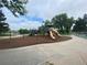 Neighborhood playground featuring multiple slides and swing sets at 7079 Estes Dr, Arvada, CO 80004