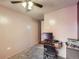 Bedroom features neutral walls, ceiling fan and a desk along the wall with carpeted floor at 1265 Colorado Blvd # 7, Denver, CO 80206