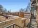 Exterior view showcasing multiple buildings and parking lot from a stairwell at 1265 Colorado Blvd # 7, Denver, CO 80206