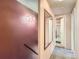 Hallway featuring carpet and a mirror, with a bathroom visible in the background at 1265 Colorado Blvd # 7, Denver, CO 80206