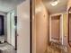 Hallway showcasing a bedroom and closet, leading to another room with neutral colored walls at 1265 Colorado Blvd # 7, Denver, CO 80206