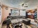 Open concept living room flows into the kitchen with bay window and comfortable furnishings at 1265 Colorado Blvd # 7, Denver, CO 80206