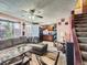 Comfortable living room seamlessly connected to kitchen and stairs, featuring cozy seating and natural light at 1265 Colorado Blvd # 7, Denver, CO 80206