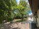 Private backyard with stone patio and lush landscaping; great for outdoor living and entertaining at 6085 Simms St, Arvada, CO 80004
