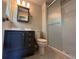 Bathroom features a shower with glass doors and a stylish vanity with drawers at 6085 Simms St, Arvada, CO 80004