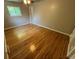 Bedroom with hardwood floors, a window providing natural light and neutral wall color at 6085 Simms St, Arvada, CO 80004