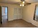 Neutral bedroom with standard ceiling fan, carpet, and natural light from a window at 6085 Simms St, Arvada, CO 80004