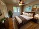 Staged bedroom featuring hardwood floors, two windows and natural light at 6085 Simms St, Arvada, CO 80004