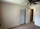 Neutral carpeted bedroom features natural light and double closet at 6085 Simms St, Arvada, CO 80004