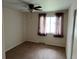 Carpeted bedroom with natural light, ceiling fan, and neutral wall paint at 6085 Simms St, Arvada, CO 80004
