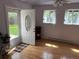 Inviting sunroom area with new floors, windows, and updated ceiling fan at 6085 Simms St, Arvada, CO 80004