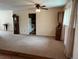 Bright living area with neutral carpet opens to the kitchen, offering a comfortable layout at 6085 Simms St, Arvada, CO 80004