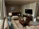 Cozy staged living room featuring a stylish sofa, elegant furniture, and ample natural light for relaxation at 6085 Simms St, Arvada, CO 80004