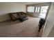 Inviting living room with neutral carpet, a comfortable sofa and a decorative plant at 6085 Simms St, Arvada, CO 80004