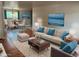 Stylishly furnished living room features hardwood floors, a plush sofa, and serene artwork for an inviting space at 6085 Simms St, Arvada, CO 80004