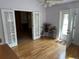 Bright living room featuring hardwood floors, glass doors, and views to the exterior at 6085 Simms St, Arvada, CO 80004