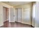 Bright bedroom features a double door closet and hardwood floors at 8459 Sweet Clover Way, Parker, CO 80134