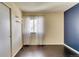 Bedroom features built-in shelving, hardwood floors, and a bright window at 8459 Sweet Clover Way, Parker, CO 80134