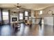 Inviting living room with hardwood floors, a fireplace, neutral decor, and a ceiling fan at 8459 Sweet Clover Way, Parker, CO 80134