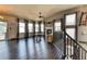 Spacious living room featuring hardwood floors, neutral decor, a fireplace, and lots of natural light at 8459 Sweet Clover Way, Parker, CO 80134