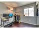 Home office includes an open window, work desk and floor rack for storage at 8459 Sweet Clover Way, Parker, CO 80134