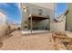 Serene backyard featuring a covered patio with comfortable seating and a gravel area with a raised garden bed at 5480 Danube St, Denver, CO 80249
