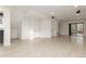 Spacious basement area with luxury vinyl plank flooring and access to the backyard at 5480 Danube St, Denver, CO 80249