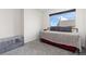 Cozy bedroom features a stylish daybed and gray ottoman, offering comfort and style at 5480 Danube St, Denver, CO 80249