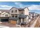 Charming two-story home featuring solar panels and a well-maintained front yard with porch and two car garage at 5480 Danube St, Denver, CO 80249