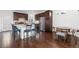 Bright kitchen features dark cabinets, stainless steel appliances, and a granite island with breakfast bar at 5480 Danube St, Denver, CO 80249