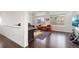 The bright living room features hardwood floors, a large window, and stylish furniture at 5480 Danube St, Denver, CO 80249