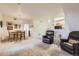 Open dining area with a wooden table and chairs, near kitchen at 5800 Tower Rd # 103, Denver, CO 80249