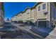 Exterior view of building with multiple garages at 5800 Tower Rd # 103, Denver, CO 80249