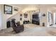 Bright living room with comfy seating and a fireplace at 5800 Tower Rd # 103, Denver, CO 80249