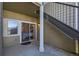 Private patio with access to bedroom and stairs at 5800 Tower Rd # 103, Denver, CO 80249