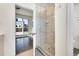 Bathroom featuring glass enclosed shower and pebble tile floor at 3044 Wilson Ct # 2, Denver, CO 80205