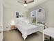 Bedroom featuring a ceiling fan, large window, and a comfortable bed at 3044 Wilson Ct # 2, Denver, CO 80205