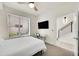 Comfortable bedroom featuring a ceiling fan, desk, and large window at 3044 Wilson Ct # 2, Denver, CO 80205
