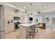 Well-lit kitchen featuring stainless appliances and an island with stool seating at 3044 Wilson Ct # 2, Denver, CO 80205