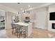 Bright kitchen featuring modern cabinetry, stainless appliances, and an island with seating at 3044 Wilson Ct # 2, Denver, CO 80205