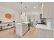 Modern kitchen with stainless steel appliances, island, and pendant lighting at 3044 Wilson Ct # 2, Denver, CO 80205