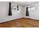 Inviting bedroom with hardwood floors and ample natural light at 4940 W 9Th Ave, Denver, CO 80204