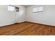 Simple bedroom features wood floors, white walls and window with blinds at 4940 W 9Th Ave, Denver, CO 80204