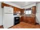 Functional kitchen with classic wooden cabinets and appliances at 4940 W 9Th Ave, Denver, CO 80204