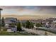 Picturesque neighborhood with stunning mountain views, charming homes, and lush greenery in the background at 10698 Mountaingate Ct, Littleton, CO 80126