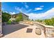 Beautiful backyard with stone fire pit, lush landscaping, and scenic views at 10698 Mountaingate Ct, Littleton, CO 80126