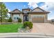 Charming single-Gathering home boasts a well-maintained lawn, mature landscaping, and a spacious three-car garage at 10698 Mountaingate Ct, Littleton, CO 80126