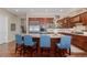 Spacious kitchen island features granite countertops, seating for four, and ample storage space at 10698 Mountaingate Ct, Littleton, CO 80126