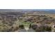 Scenic landscape with meandering trails and a rustic outdoor amphitheater in a natural setting at 10698 Mountaingate Ct, Littleton, CO 80126