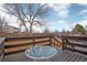 Back deck features a table and views of the backyard, perfect for outdoor relaxation and entertainment at 7949 W Portland Ave, Littleton, CO 80128